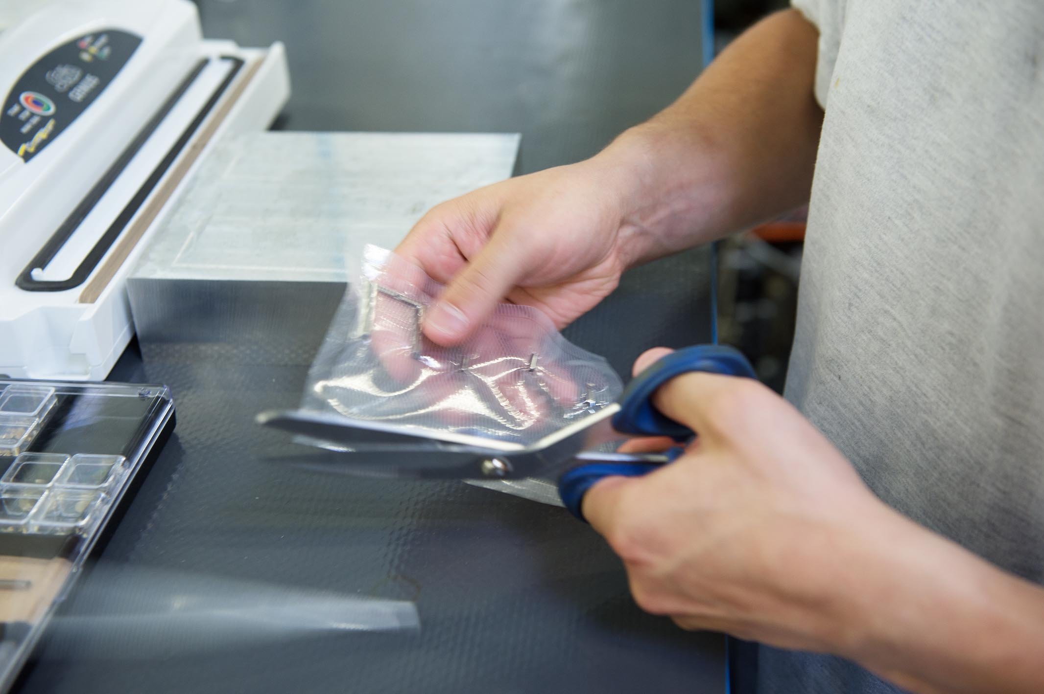 Last steps: any leftover packaging material is cut away.