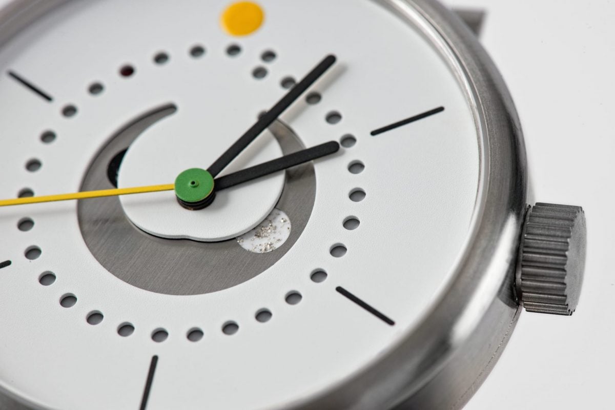 moon phase watch (42mm grade 5 titanium case case with white dial and yellow strap by ochs und junior, close up)