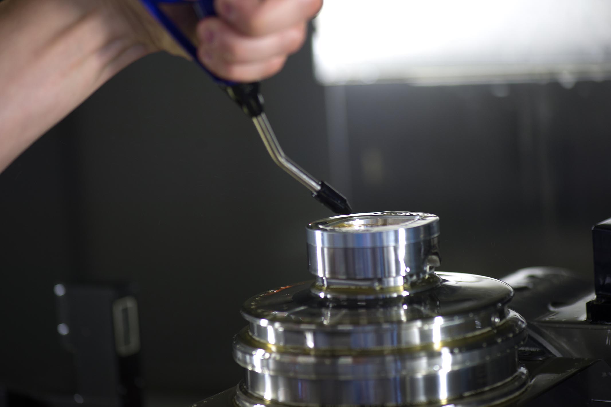 The dial has to be secured before it can be separated from the spare material in order to make sure that it stays in the right position and will not be damaged in the milling process.
