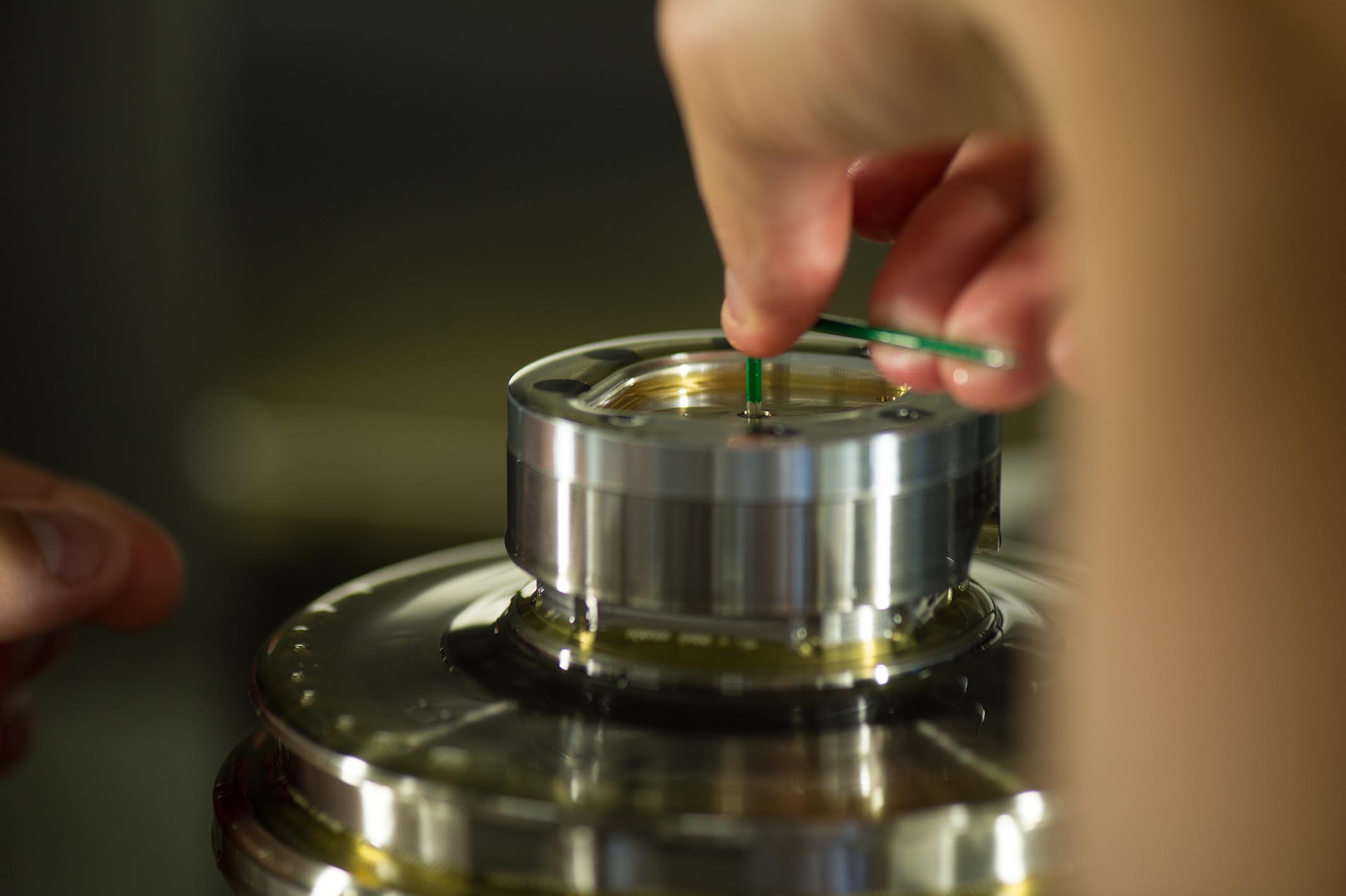 To secure the dial, Daniel Matter screws it down. He inserts a little circular piece of plastic in-between the dial and the head of the screw in order to prevent imprints and scratches on the dial’s surface.