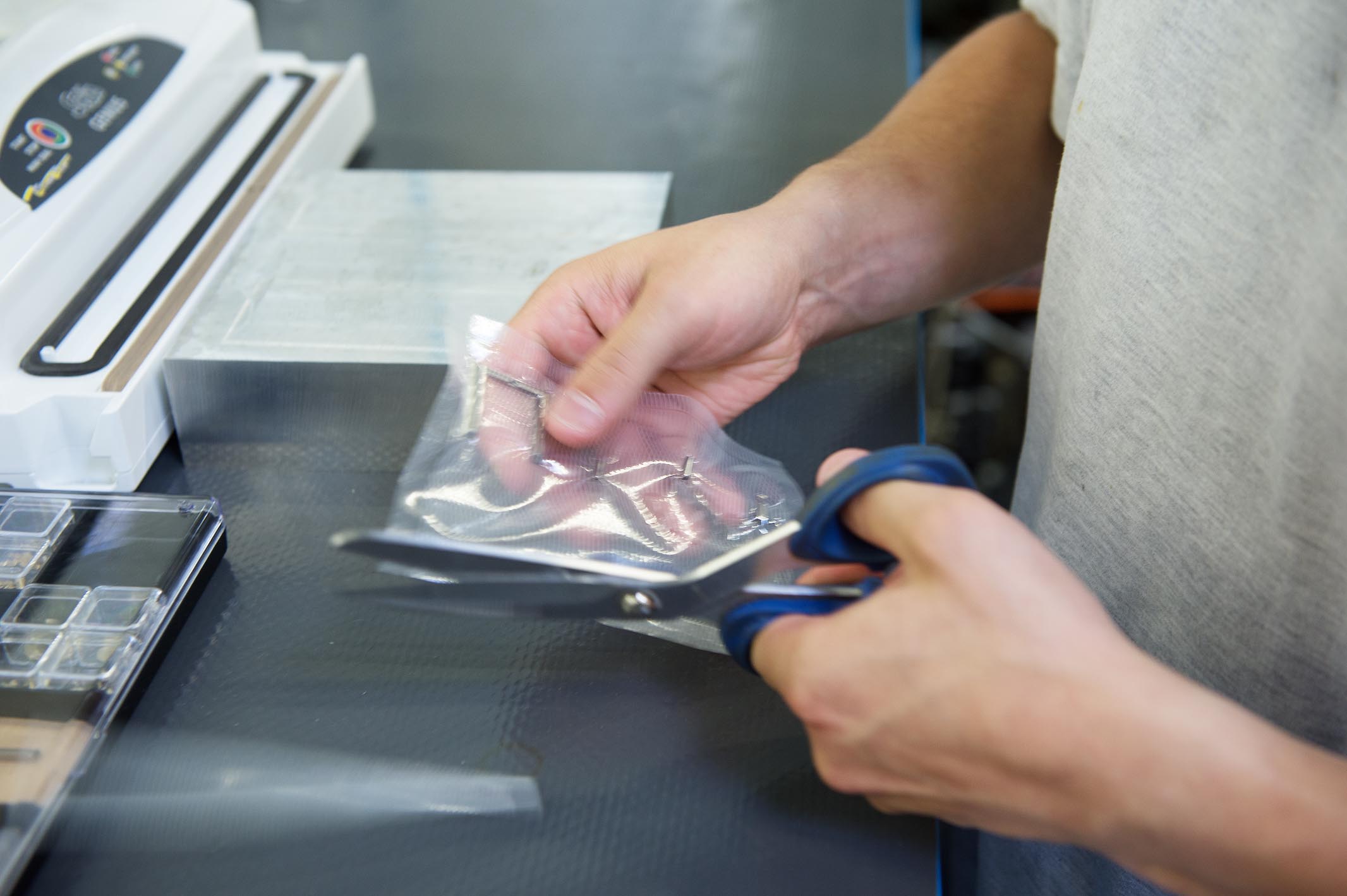 Last steps: any leftover packaging material is cut away.